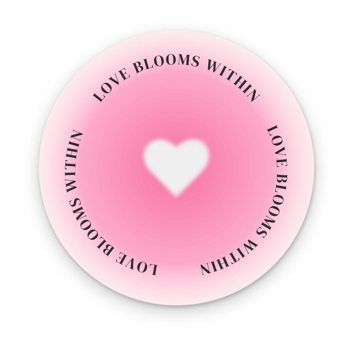 Cuadro circular Love Blooms Within en acrílico, corazón blanco en aura rosa con frase en círculo
